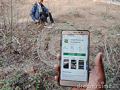 dreamstime royalty free stock photography app displayed on digital screen holded hand mobile concept in India dec 2019 Editorial Stock Photo