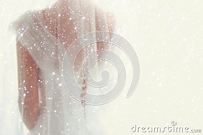 Dreamy abstract and blurry background of beautiful bride with wedding dress, from behind Stock Photo