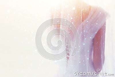 Dreamy abstract and blurry background of beautiful bride with wedding dress, from behind Stock Photo