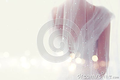 Dreamy abstract and blurry background of beautiful bride with wedding dress, from behind Stock Photo