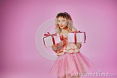 dreamy blonde woman in pink outfit Stock Photo