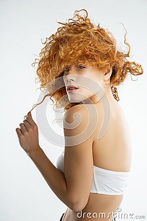 Dreamy Caucasian girl wearing a strapless bra Stock Photo
