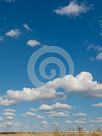 Dreamy cloudscape over the wild field Stock Photo