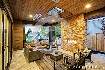 Dreamy outdoor covered patio with stone fireplace Stock Photo