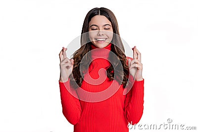 dreamy teen girl making wish. dream of a teen girl. dreamy teenager girl. making wish with crossed fingers. the biggest Stock Photo