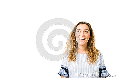 Dreamy and wishful woman thinking and looking up Stock Photo