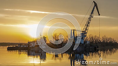 Dredger is working to deepen the fairway on the river. Cleaning and deepening by a dredger on the river Stock Photo