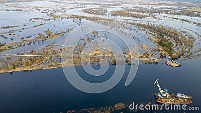 Dredger is working to deepen the fairway on the river. Cleaning and deepening by a dredger on the river Stock Photo