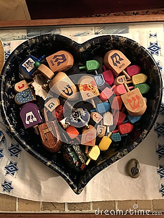 Dreidels in a Heart Shaped Container for Hanukkah Ce Stock Photo