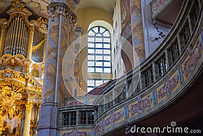 Dresden, Germany - June 28, 2022: Inside the church of our Lady or Frauenkirche Dresden. Golden Interior with view of altar in the Editorial Stock Photo