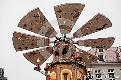 Dresden, Saxony, Germany, 10 December 2022: Christmas outdoor market stall decorations with fairy with lights, Rotating wooden Editorial Stock Photo