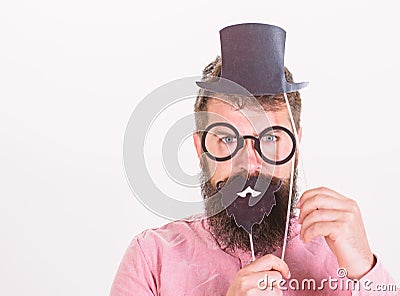 Dress affects how people see you. Man bearded hipster hold cardboard top hat and eyeglasses to look smarter white Stock Photo