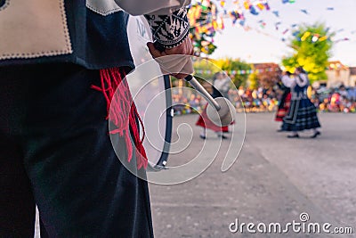 Detail of bass drum, typical instrument. Person who dances in the background, traditional dance of Segovia Stock Photo