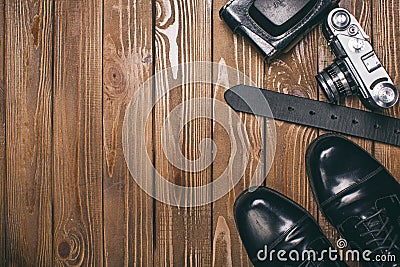 Dress shoes, belt and a camera - photography Stock Photo