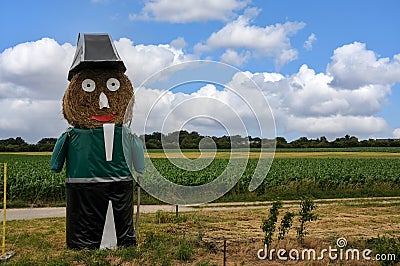 Giant straw doll dressed as the officer of the guard Stock Photo