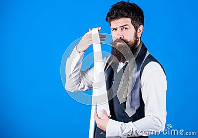 When dressing in suit necktie often add dash of flavor to overall outfit. Guy with beard choosing necktie. Perfect white Stock Photo