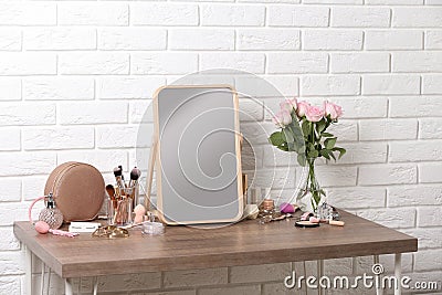 Dressing table with different makeup products and accessories Stock Photo