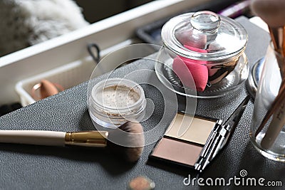 Dressing table with powder, brush, mineral foundation, sponges Stock Photo