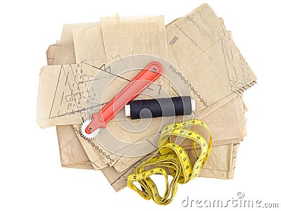 Dressmaking, sewing equipment isolated on white. Paper pattern thread, marker etc. Stock Photo