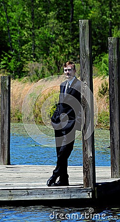 Dressy Business Suit and Wooden Dock Stock Photo