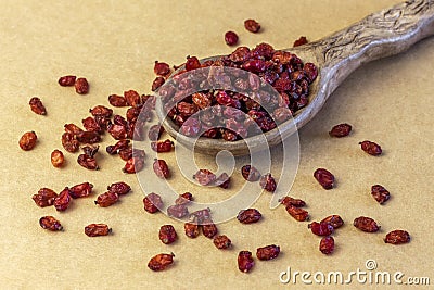 Dried barberry in ceramic spoon Stock Photo