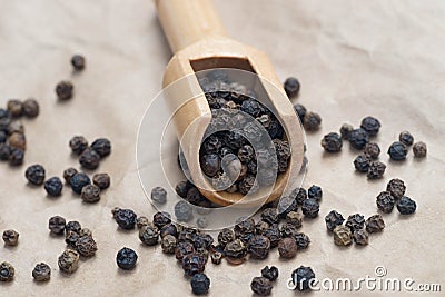 Dried black pepper in measuring spoon Stock Photo