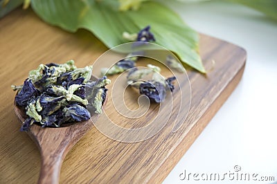 Dried butterfly pea flowers on spoon Stock Photo