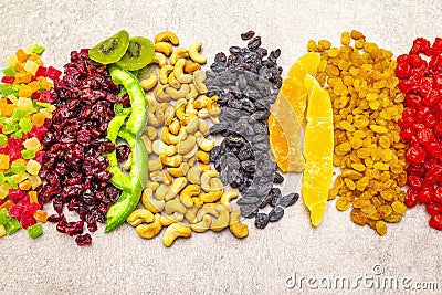 Dried and candied fruit and cashew nuts. Assorted on a stone background. Healthy vegetarian vegan food concept Stock Photo