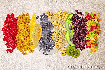 Dried and candied fruit and cashew nuts. Assorted on a stone background. Healthy vegetarian vegan food concept Stock Photo