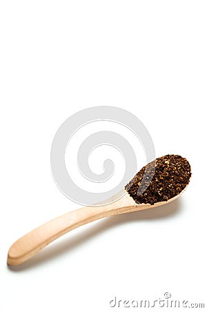 A dried chili flakes in a wooden spoon Stock Photo