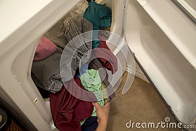 Dried clothes in dryer of house Stock Photo