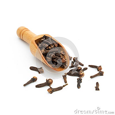 dried cloves wooden spoon on white Stock Photo
