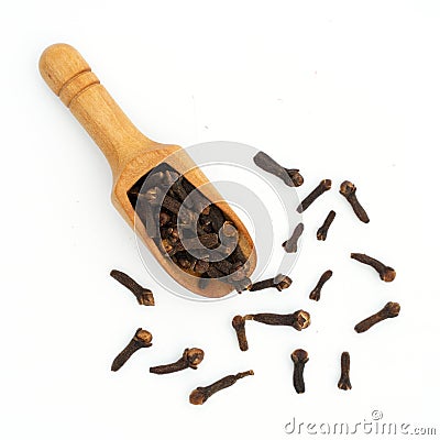 dried cloves wooden spoon on white Stock Photo