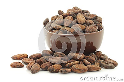 Dried cocoa beans in a brown bowl Stock Photo