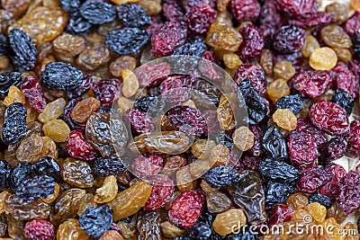 dried cranberries with yellow and black raisins mixed together Stock Photo