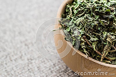 Dried Dead Nettle / isirgan otu or urtica urens in wooden ladle Stock Photo