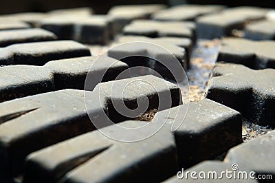 Dried dirt on the tread of the boot. close-up Stock Photo