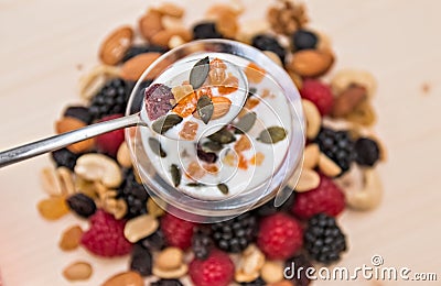 Dried fruit mix raspberry, mixed nuts and yogurt. Stock Photo