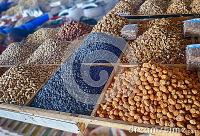 Dried fruit and roasted nuts for sale at the Chorsu market Tashkent Stock Photo