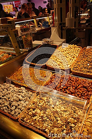 Dried fruit stand at the market La Boqueria, Barcelona Editorial Stock Photo