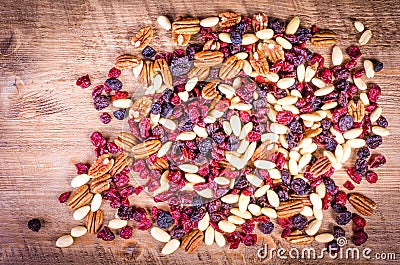 Dried fruits - pecan, cranberry, raisin, almond on wooden Stock Photo