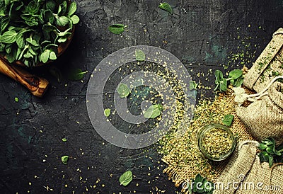 Dried ground oregano or marjoram, dark background, top view Stock Photo