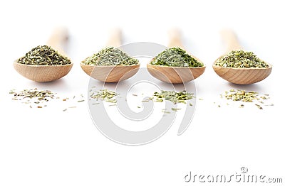 Dried Herbs on Wooden Spoons Stock Photo