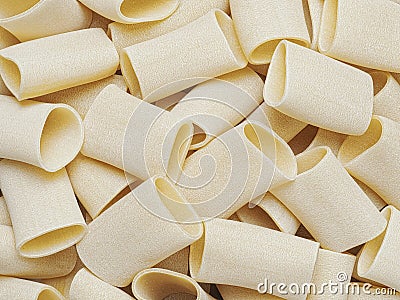 Dried italian paccheri tube pasta food background Stock Photo