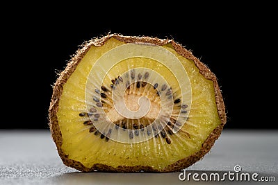Dried kiwi fruit slice on drak background Stock Photo