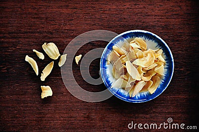 Dried lily in bowl Stock Photo