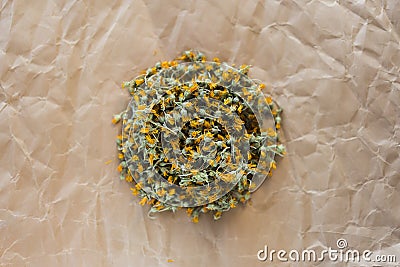 Dried marigold on old paper, Stock Photo