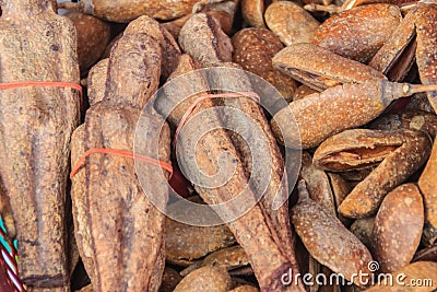 Dried Nariphon fruits for sale at the amulet market, Thailand. T Stock Photo