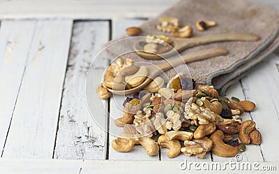Dried nuts - cashew, almond,walnut and berry on white wooden table Stock Photo