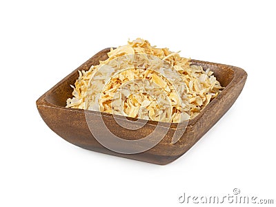 Dried onion in wooden bowl isolated on white Stock Photo